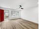 Bright living room featuring hardwood floors, modern ceiling fan, and large windows offering ample natural light at 193 High Creek Dr, Roswell, GA 30076