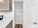Walk-in pantry with wire shelving and wood floors adjacent to kitchen at 193 High Creek Dr, Roswell, GA 30076