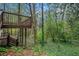 Private backyard featuring a deck, stairs, and lush greenery providing a peaceful outdoor retreat at 2183 Seaman Cir, Atlanta, GA 30341
