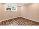 Finished basement with luxury floors and a window at 2183 Seaman Cir, Atlanta, GA 30341