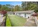 Exterior community building with manicured lawn and seating area at 2183 Seaman Cir, Atlanta, GA 30341