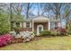 Charming brick home featuring a well-manicured front yard with colorful flower beds and lush landscaping at 2183 Seaman Cir, Atlanta, GA 30341