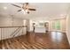 Bright living room featuring hardwood floors that flow into an open-concept kitchen and access to a deck at 2183 Seaman Cir, Atlanta, GA 30341