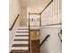 Bright staircase with natural light and white wood railings at 2183 Seaman Cir, Atlanta, GA 30341