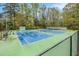 Active community tennis courts with well-maintained green and blue playing surfaces and viewing area at 2183 Seaman Cir, Atlanta, GA 30341
