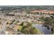 Aerial view of the community showcasing well-manicured lawns, mature trees, and a tranquil pond at 260 Millstone Pkwy, Woodstock, GA 30188
