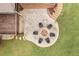 Aerial view of fire pit area on a stone patio, located on the yard of a home with a deck at 260 Millstone Pkwy, Woodstock, GA 30188