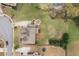 Expansive lot with lush green lawn, fire pit, and mature trees bordering a pond in a desirable neighborhood at 260 Millstone Pkwy, Woodstock, GA 30188