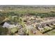 Community aerial view of well-manicured properties with established homes, lush foliage, and a peaceful lake at 260 Millstone Pkwy, Woodstock, GA 30188