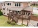 Elevated view of a backyard with a deck, outdoor seating, and landscaping at 260 Millstone Pkwy, Woodstock, GA 30188