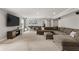 Entertainment space with TV, large sectional sofa, and bar seating in a finished basement at 260 Millstone Pkwy, Woodstock, GA 30188