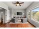 This bonus room boasts hardwood floors, natural light, a ceiling fan, and built-in storage at 260 Millstone Pkwy, Woodstock, GA 30188