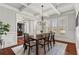 Elegant dining room featuring wainscoting, coffered ceilings, and hardwood floors creating a refined ambiance at 260 Millstone Pkwy, Woodstock, GA 30188
