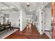 Inviting foyer with gleaming hardwood floors, white trim, and coffered ceilings, creating a grand entrance at 260 Millstone Pkwy, Woodstock, GA 30188