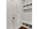 Convenient mudroom with built-in storage, hooks, and a bench, providing practical organization space at 260 Millstone Pkwy, Woodstock, GA 30188