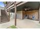 Covered patio featuring a seating area with hanging hammock chairs and a brick wall at 260 Millstone Pkwy, Woodstock, GA 30188