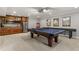 Recreation room with kitchenette, pool table, and shuffleboard, perfect for entertaining at 260 Millstone Pkwy, Woodstock, GA 30188