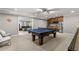 Recreation room with kitchenette, pool table, and shuffleboard, perfect for entertaining at 260 Millstone Pkwy, Woodstock, GA 30188