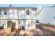 View of backyard with sliding glass doors opening onto a concrete patio area at 2960 Fields Dr, Lithonia, GA 30038