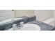 A marble-look sink and mirror in the bathroom at 2960 Fields Dr, Lithonia, GA 30038