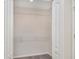 A spacious walk-in closet with built-in shelving and carpeting at 2960 Fields Dr, Lithonia, GA 30038