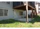 Patio with stairs leading to deck above. The lower level door provides easy backyard access at 3220 Warren Creek Dr, Powder Springs, GA 30127