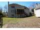 Large backyard featuring ample space and a glimpse of the home's rear exterior at 3220 Warren Creek Dr, Powder Springs, GA 30127