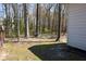 Spacious backyard with mature trees, offering a serene and private outdoor space at 3220 Warren Creek Dr, Powder Springs, GA 30127