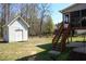 Expansive backyard with a shed, offering ample space for outdoor activities and storage at 3220 Warren Creek Dr, Powder Springs, GA 30127