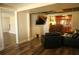 Spacious basement with wood floors, seating, a bar, and a stairwell at 3220 Warren Creek Dr, Powder Springs, GA 30127