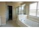 Bathroom boasts a jacuzzi tub and a glass shower enclosure at 3220 Warren Creek Dr, Powder Springs, GA 30127