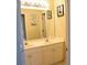 Bathroom featuring double sinks, white cabinets, and ample counter space under a large mirror at 3220 Warren Creek Dr, Powder Springs, GA 30127
