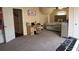 Bright bedroom with neutral walls and carpet, furnished with a bed, desk, and keyboard setup at 3220 Warren Creek Dr, Powder Springs, GA 30127