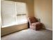 Bright bedroom features a chair and large window at 3220 Warren Creek Dr, Powder Springs, GA 30127