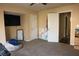 Spacious bedroom features carpeted floors, a large television, and a comfortable beanbag chair at 3220 Warren Creek Dr, Powder Springs, GA 30127