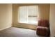 Bedroom boasts a bright window at 3220 Warren Creek Dr, Powder Springs, GA 30127