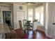 Bright breakfast nook with a glass table, stylish chairs, and access to an outdoor porch at 3220 Warren Creek Dr, Powder Springs, GA 30127
