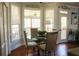 Cozy breakfast nook with a glass-top table, comfortable seating, and natural light from bay windows at 3220 Warren Creek Dr, Powder Springs, GA 30127