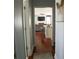 Hallway featuring hardwood floors and a view into an open living space at 3220 Warren Creek Dr, Powder Springs, GA 30127