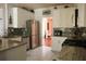 Functional kitchen with stainless steel appliances, granite countertops, and ample cabinet space at 3220 Warren Creek Dr, Powder Springs, GA 30127