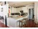 Bright kitchen featuring white cabinetry, granite countertops, and a convenient breakfast bar with seating at 3220 Warren Creek Dr, Powder Springs, GA 30127