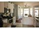 Well-lit kitchen with white cabinets, stainless steel appliances, and a tile floor with a breakfast nook at 3220 Warren Creek Dr, Powder Springs, GA 30127
