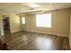 Finished basement featuring a modern flooring, a bright window, and access to the outside at 3220 Warren Creek Dr, Powder Springs, GA 30127