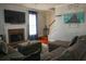 Inviting living room with a fireplace, large TV, and comfortable seating area at 3220 Warren Creek Dr, Powder Springs, GA 30127