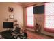 Office space setup with dual monitors and rose colored accents at 3220 Warren Creek Dr, Powder Springs, GA 30127