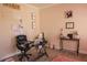 Home office setup with black desk, computer, and organizational decor at 3220 Warren Creek Dr, Powder Springs, GA 30127