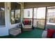 Relaxing screened porch area, perfect for enjoying the outdoors with cozy seating and natural light at 3220 Warren Creek Dr, Powder Springs, GA 30127