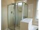 Shower features glass doors at 3220 Warren Creek Dr, Powder Springs, GA 30127