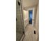 Bright bathroom featuring wood look tile, neutral tones, and a modern vanity at 695 Pine Shadows Dr, Dallas, GA 30157