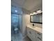 Bright bathroom featuring modern vanity, neutral tones, and shower at 695 Pine Shadows Dr, Dallas, GA 30157